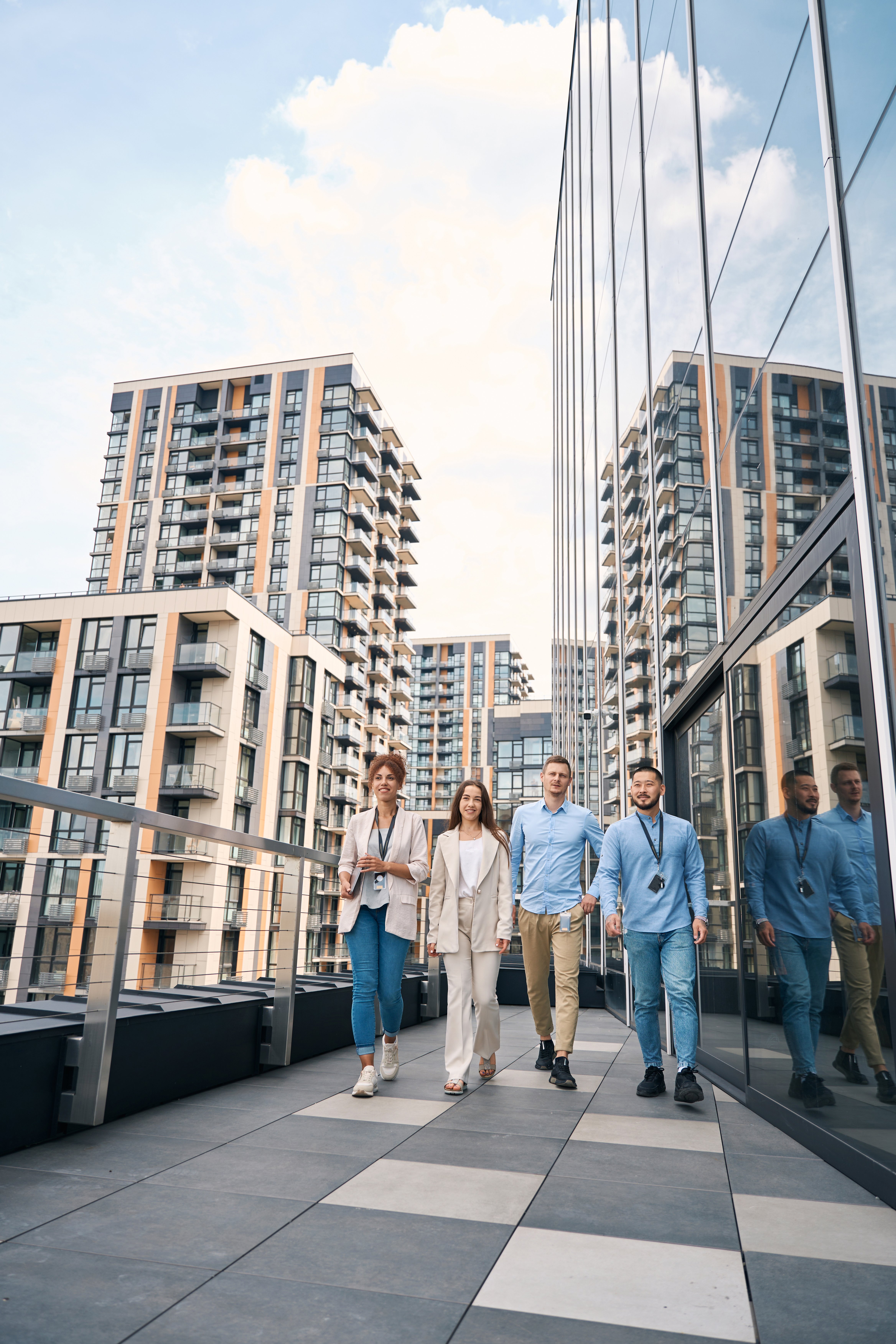 multiethnic-team-of-corporate-workers-strolling-du-2025-03-09-18-42-35-utc